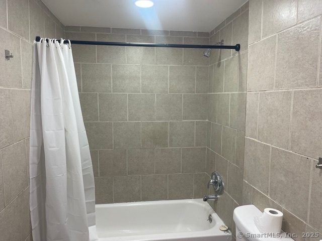 90 Waterville Street Waterbury, CT 06710 - Photo 8 of 20 a bathroom with a shower and a toilet