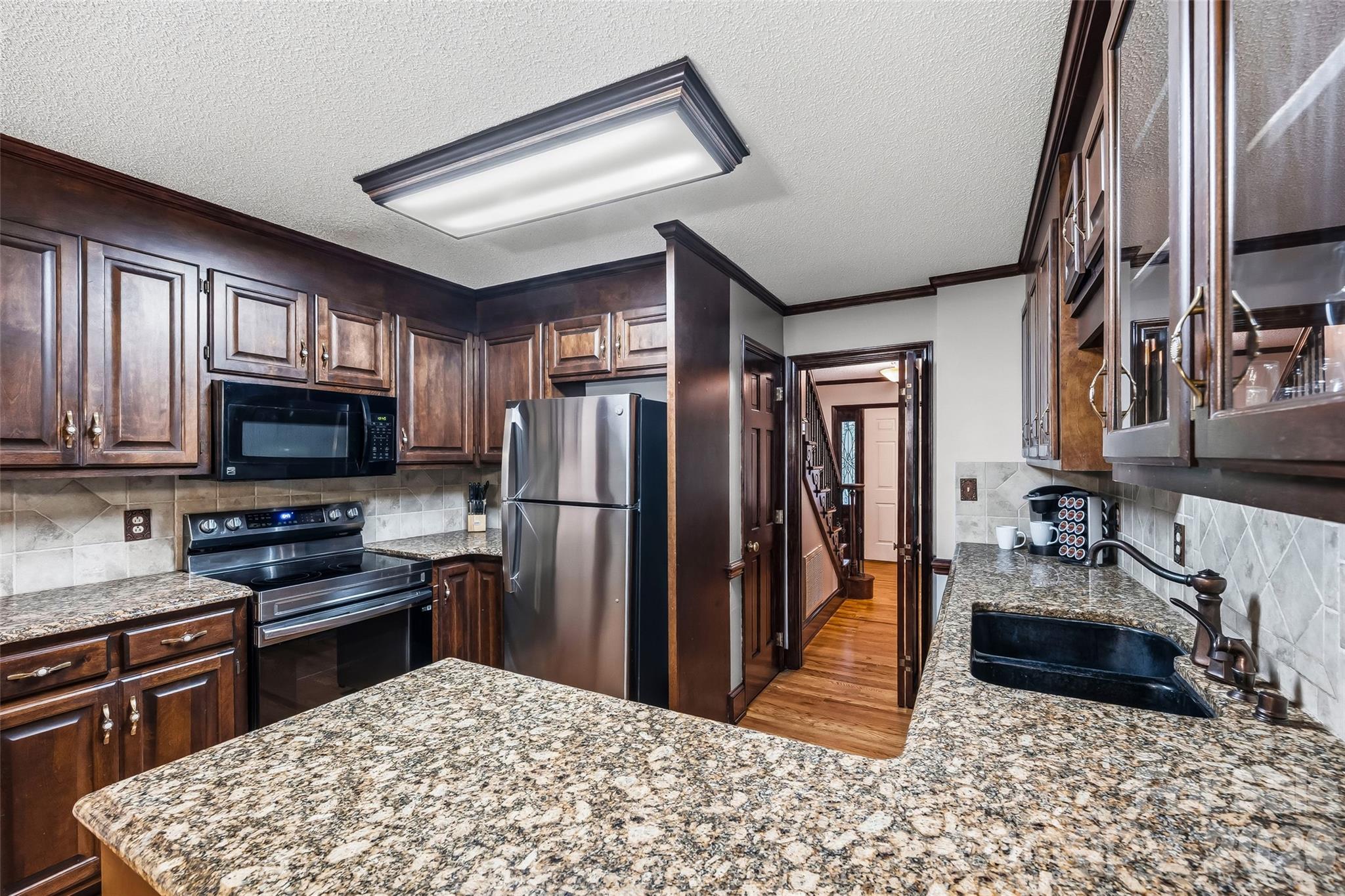 1596 Old Tara Lane Fort Mill, SC 29708 - Photo 12 of 47 a kitchen with stainless steel appliances granite countertop a refrigerator stove top oven a sink and dishwasher