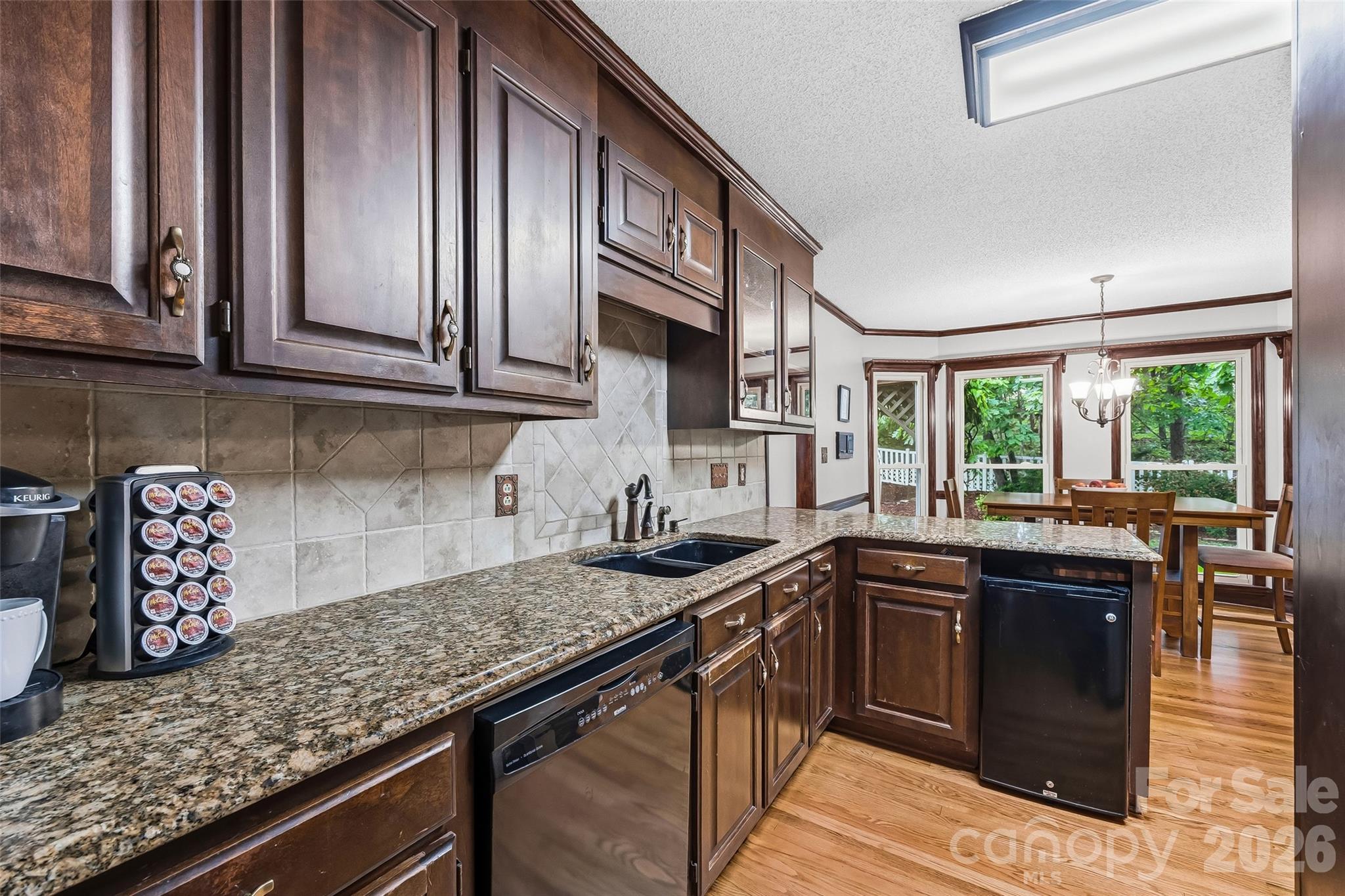1596 Old Tara Lane Fort Mill, SC 29708 - Photo 14 of 47 a kitchen with stainless steel appliances granite countertop a sink stove and cabinets