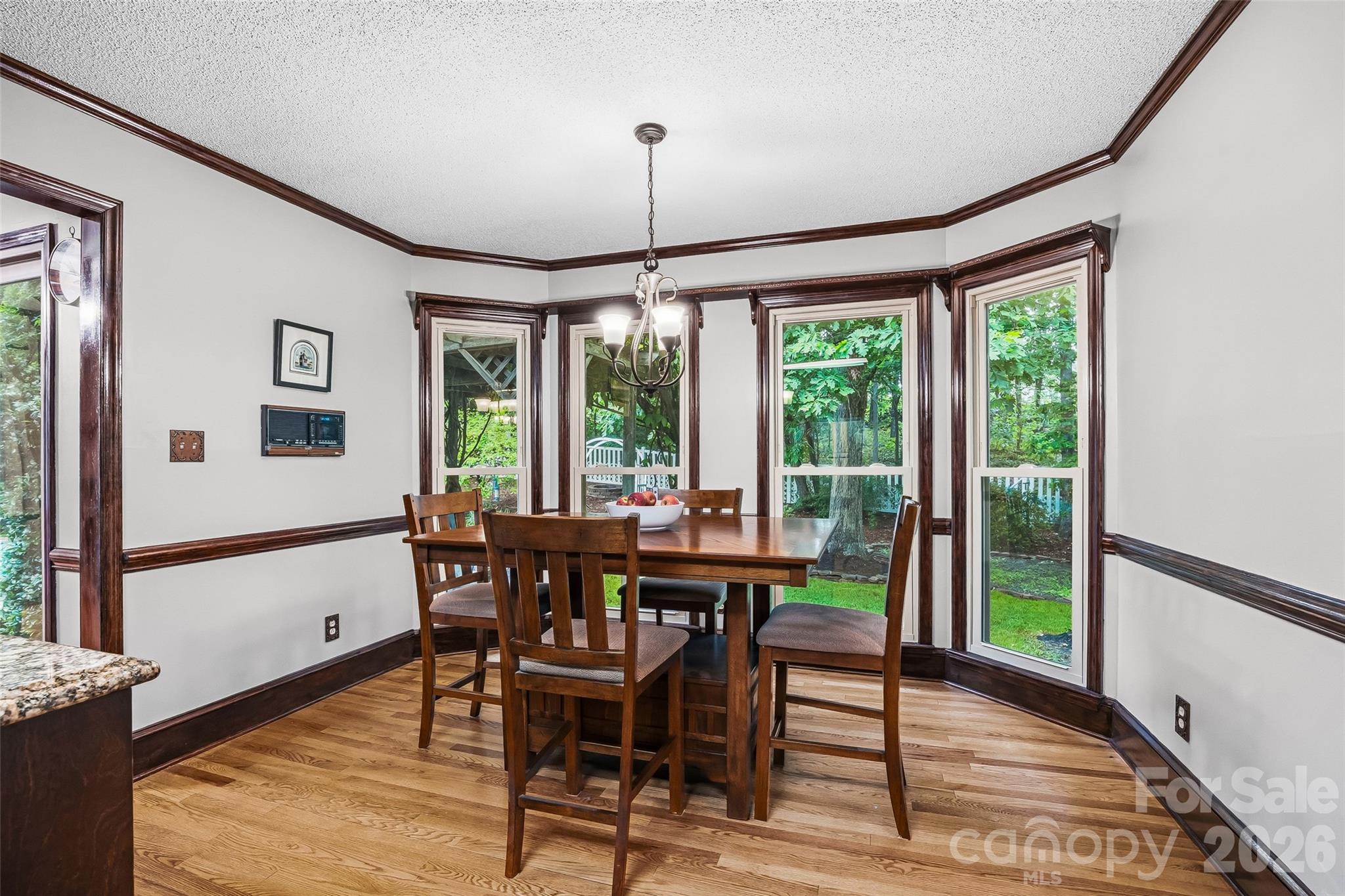 1596 Old Tara Lane Fort Mill, SC 29708 - Photo 16 of 47 a view of a dining room with furniture window and wooden floor