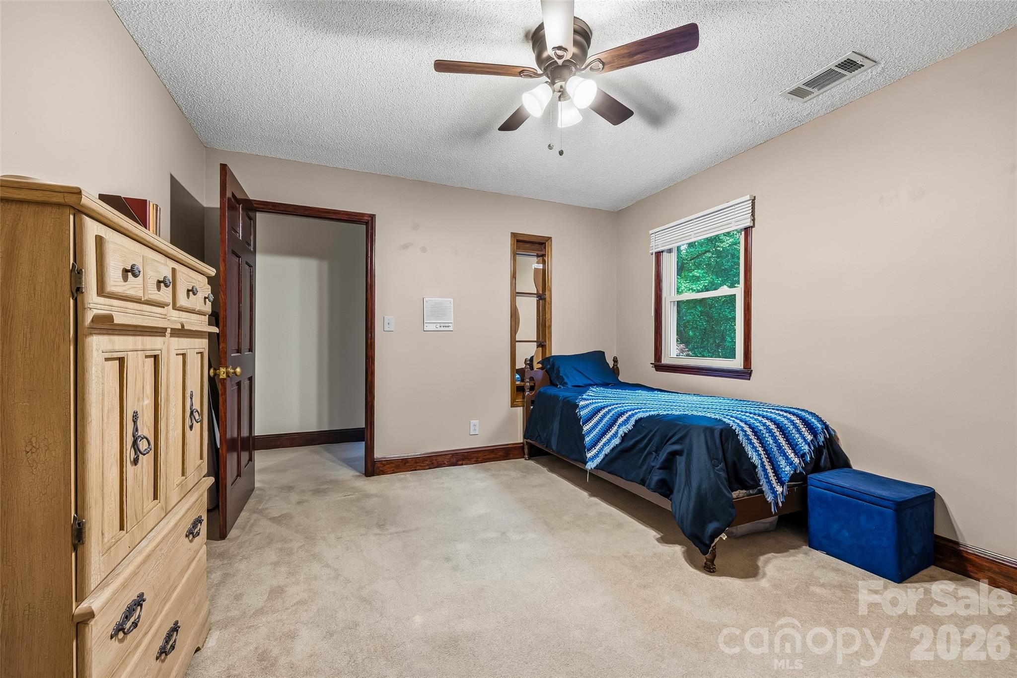 1596 Old Tara Lane Fort Mill, SC 29708 - Photo 22 of 47 a spacious bedroom with a bed and a chandelier