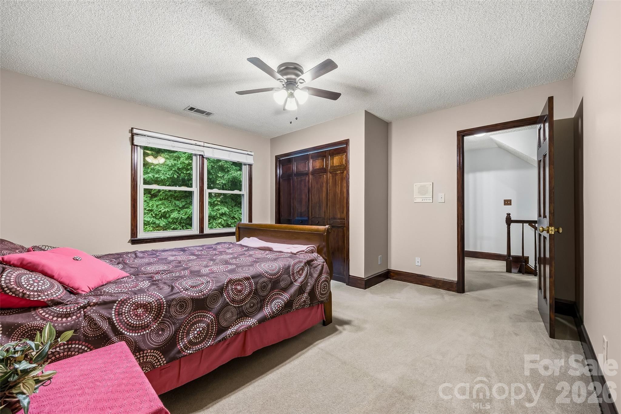 1596 Old Tara Lane Fort Mill, SC 29708 - Photo 25 of 47 a bedroom with a bed and a large window