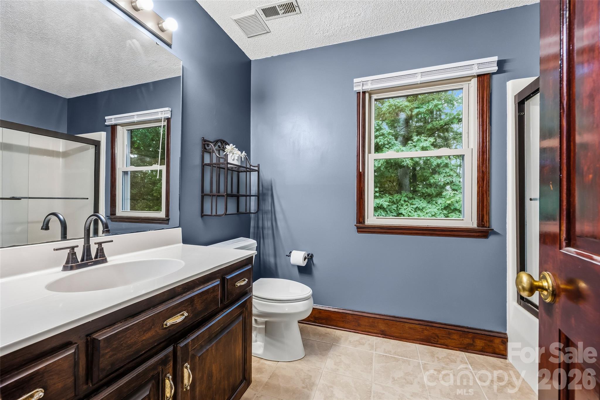 1596 Old Tara Lane Fort Mill, SC 29708 - Photo 26 of 47 a bathroom with a sink a toilet and a window