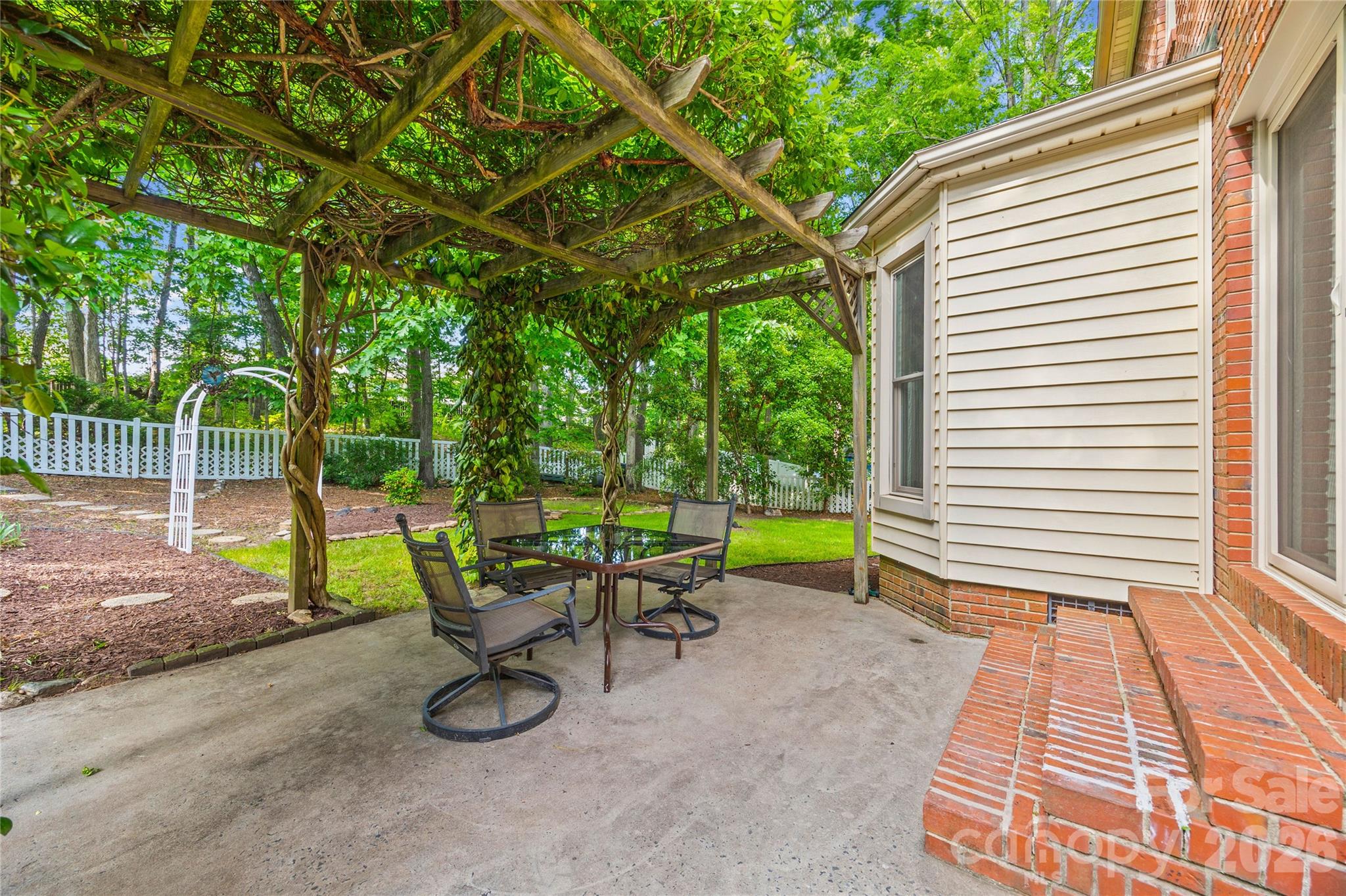 1596 Old Tara Lane Fort Mill, SC 29708 - Photo 36 of 47 a view of a chairs and table in backyard