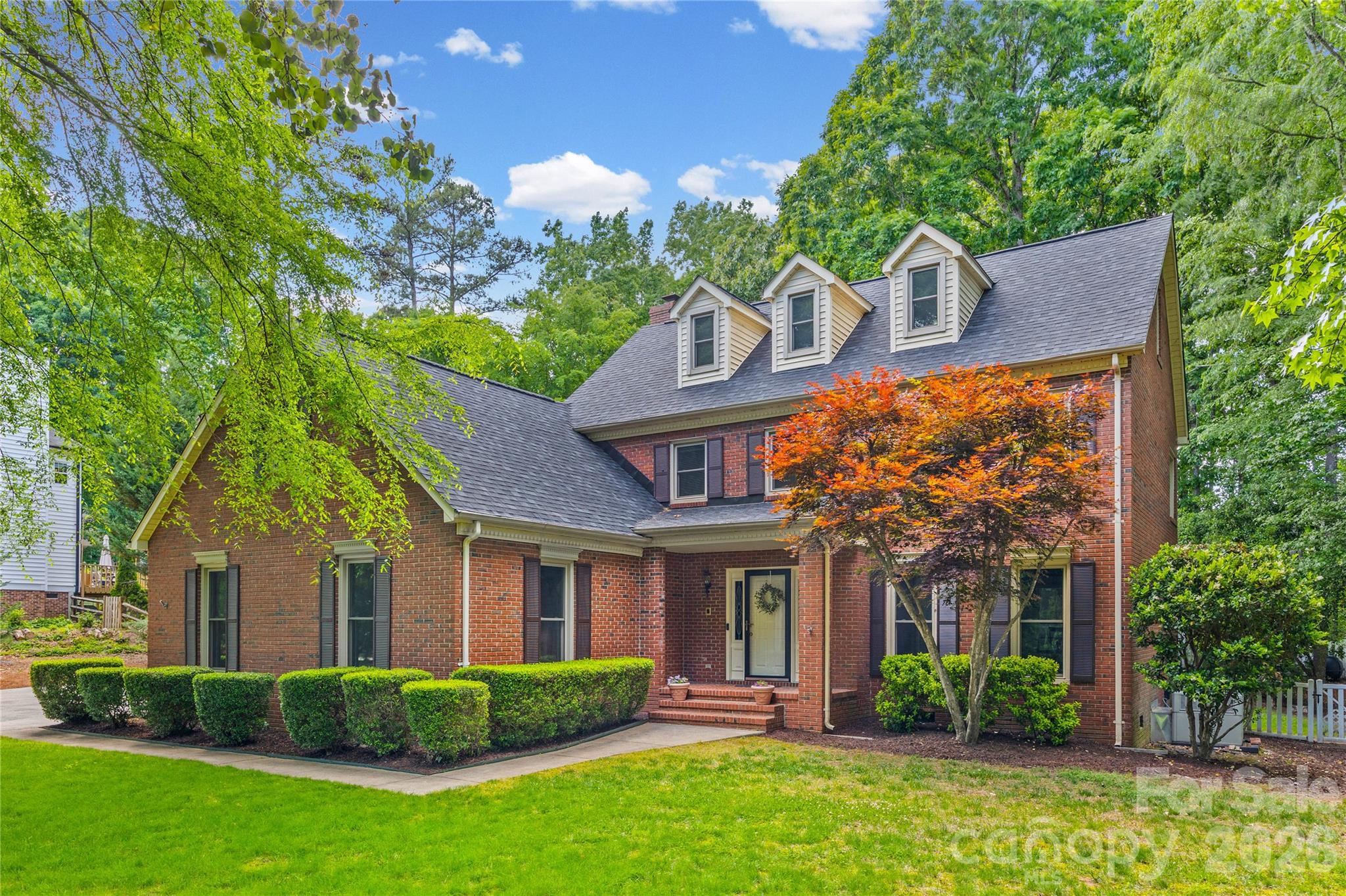 1596 Old Tara Lane Fort Mill, SC 29708 - Photo 4 of 47 a front view of a house with garden