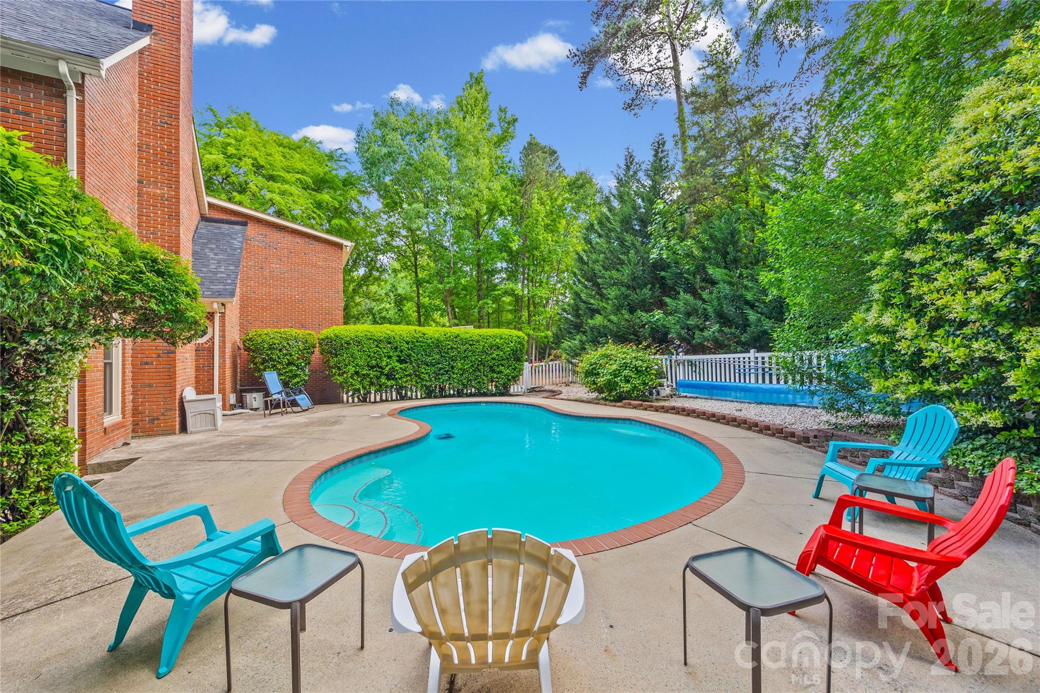 1596 Old Tara Lane Fort Mill, SC 29708 - Photo 42 of 47 a view of a swimming pool with a lounge chair