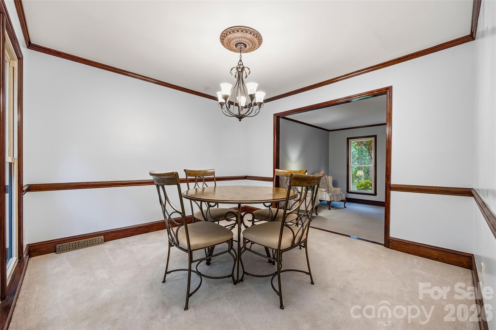 1596 Old Tara Lane Fort Mill, SC 29708 - Photo 9 of 47 a view of a dining room with furniture and chandelier