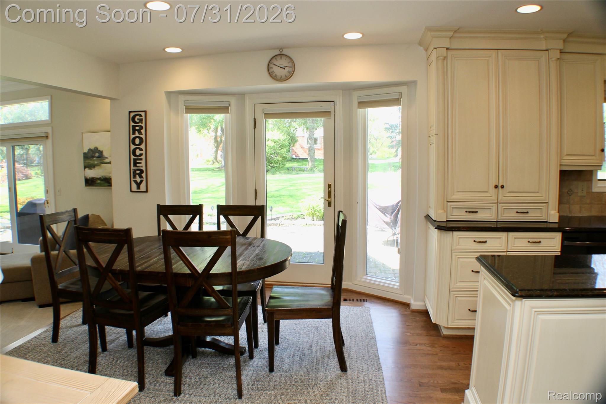 362 Lake Forest Road Rochester, MI 48309 - Photo 20 of 50 Kitchen-dining area featuring cream-colored cabinetry, dark countertops, and recessed lighting