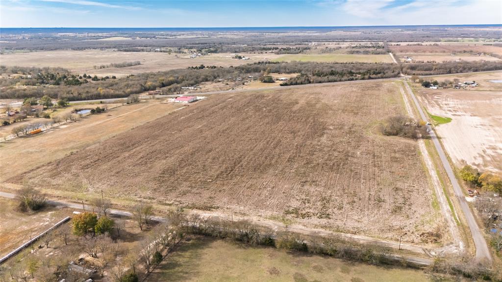 Lot 10 County Road 4609 Commerce, TX 75428 - Photo 9 of 19 Aerial overview of property's location with rural landscape