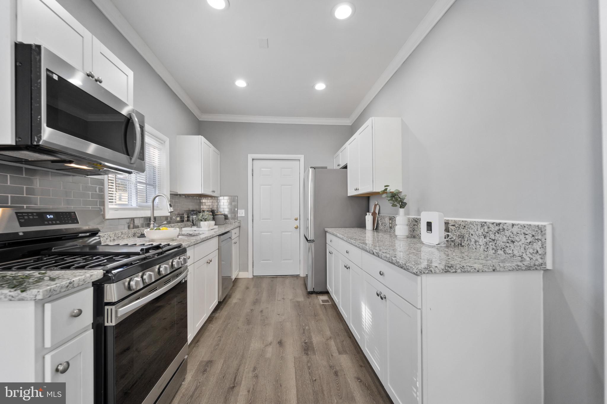 2808 Chelsea Terrace Baltimore, MD 21216 - Photo 6 of 29 Modern kitchen with sleek finishes.
