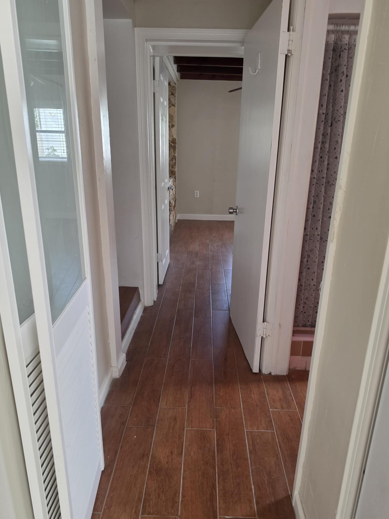 5935 Taft Street, Unit 1 Hollywood, FL 33021 - Photo 4 of 9 a view of a hallway and wooden floor