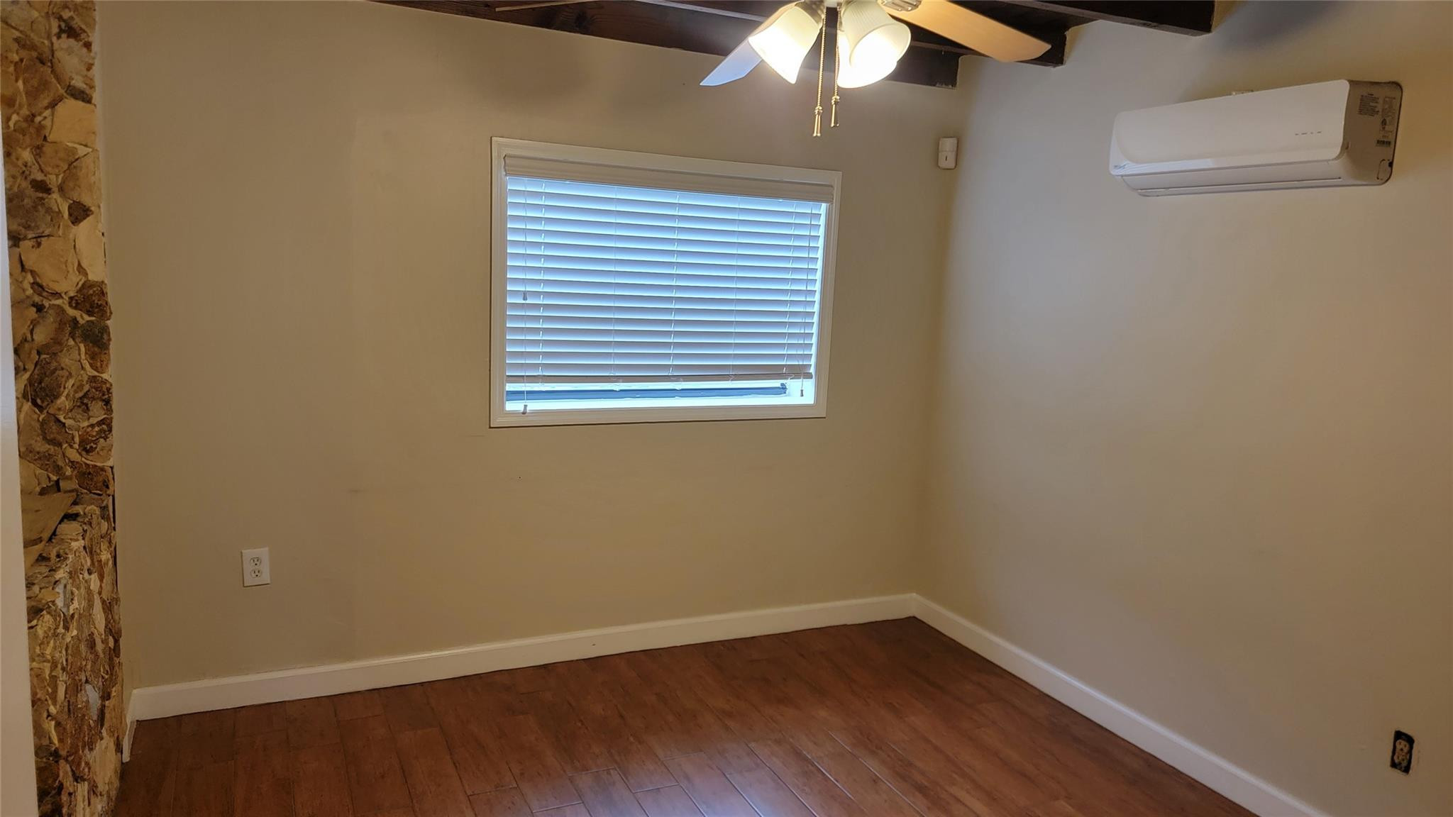 5935 Taft Street, Unit 1 Hollywood, FL 33021 - Photo 5 of 9 an empty room with a window
