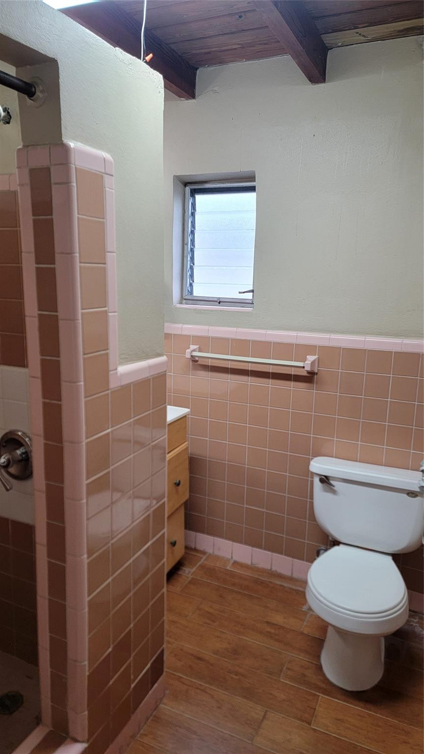 5935 Taft Street, Unit 1 Hollywood, FL 33021 - Photo 7 of 9 a bathroom with a toilet and a shower