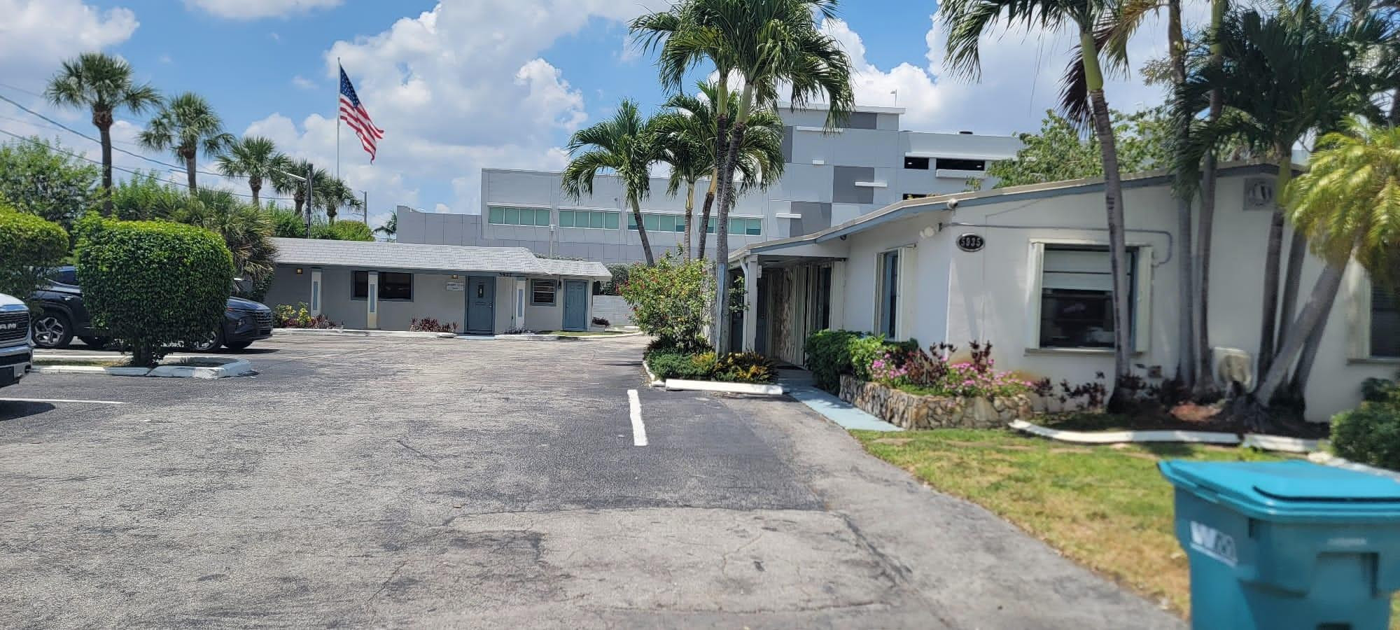 5935 Taft Street, Unit 1 Hollywood, FL 33021 - Photo 9 of 9 a front view of a house with yard and tree s