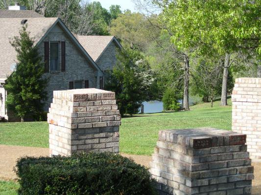 6386 Morton Road Greenbrier, TN 37073 - Photo 3 of 15 a view of a house with yard and a garden