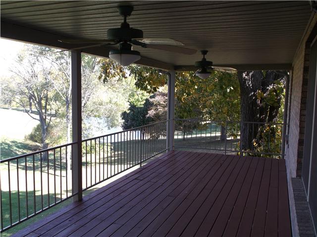 6386 Morton Road Greenbrier, TN 37073 - Photo 5 of 15 a view of a porch with wooden floor