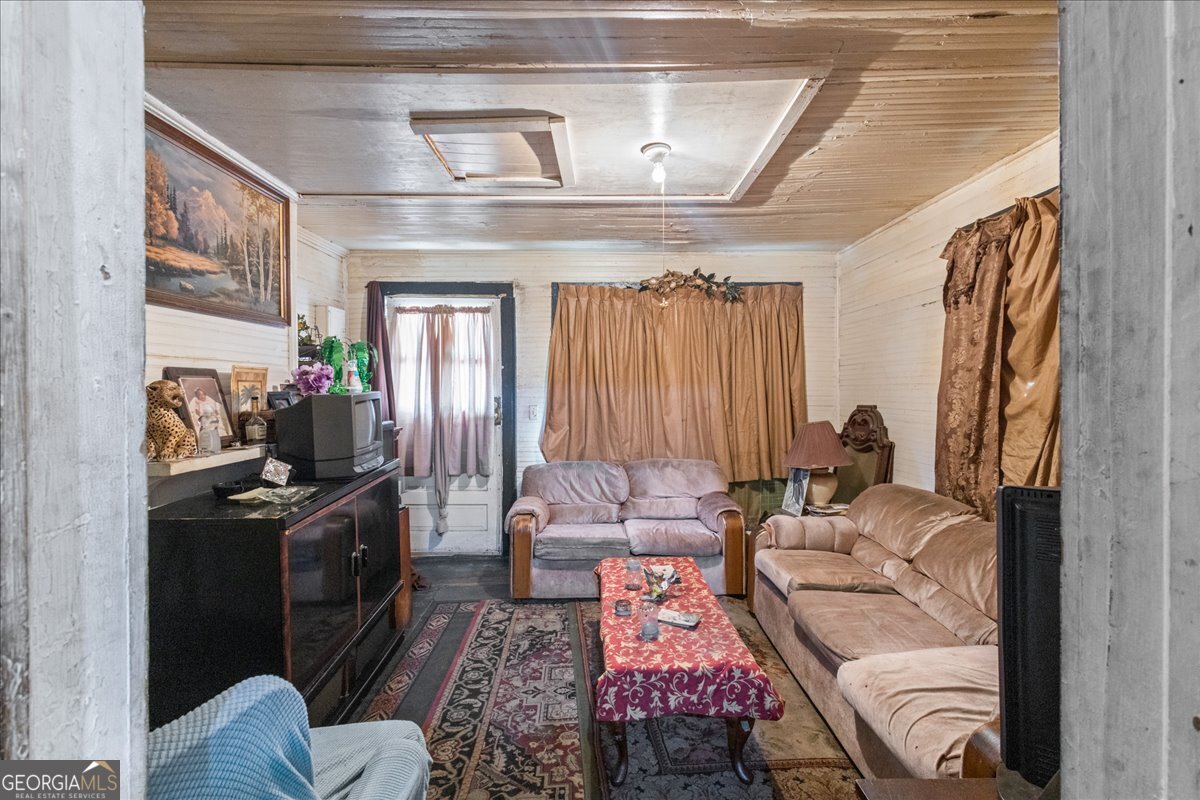 1377 Wrightsboro Road Augusta, GA 30901 - Photo 20 of 49 a living room with furniture and a fireplace