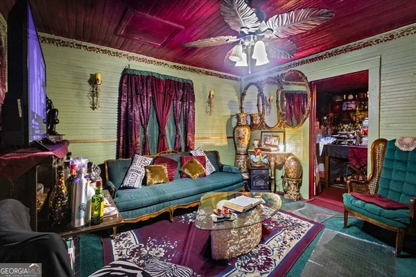 a living room with lots of furniture and a fireplace