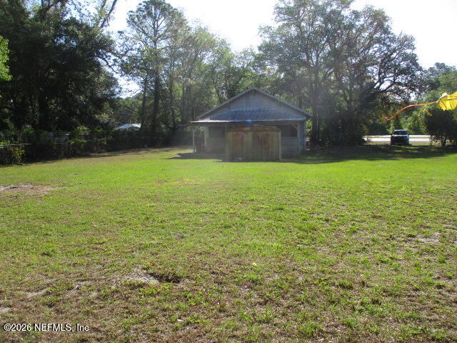 9742 Highway 301 Hampton, FL 32044 - Photo 1 of 19 a backyard of a house with lots of green space