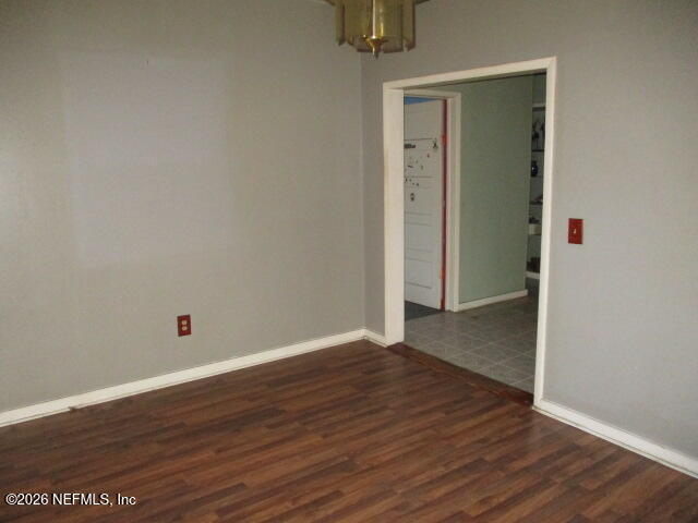 9742 Highway 301 Hampton, FL 32044 - Photo 12 of 19 an empty room with wooden floor and closet