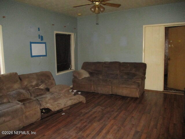 9742 Highway 301 Hampton, FL 32044 - Photo 13 of 19 a living room with furniture and a wooden floor