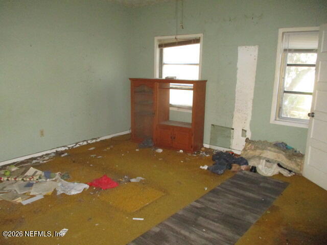 9742 Highway 301 Hampton, FL 32044 - Photo 17 of 19 a bedroom with a bed and window