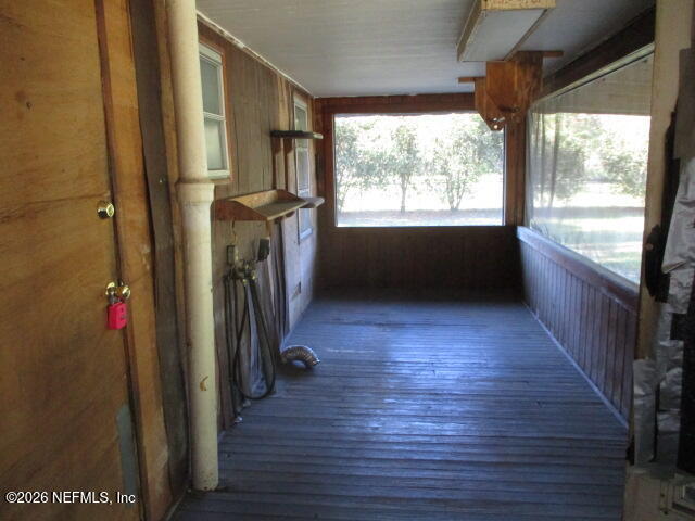 9742 Highway 301 Hampton, FL 32044 - Photo 8 of 19 a view of hallway with stairs and wooden floor