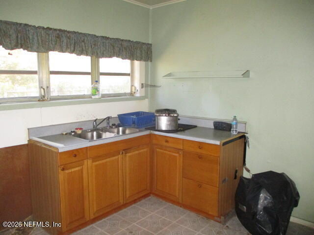 9742 Highway 301 Hampton, FL 32044 - Photo 10 of 19 a kitchen that has a sink and a stove
