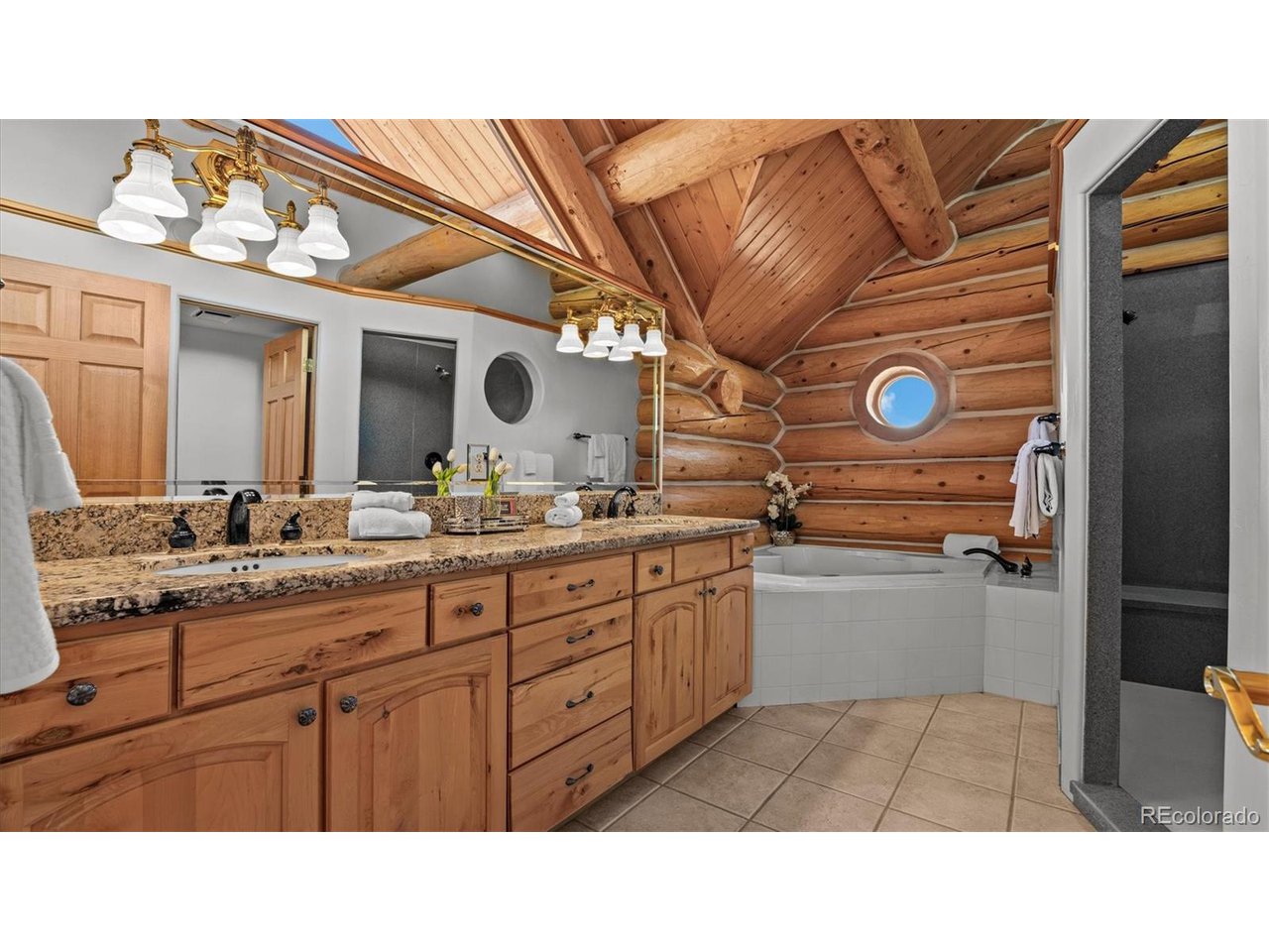 3875 F F 3/4 Road Palisade, CO 81526 - Photo 30 of 45 a bathroom with a sink a mirror and a vanity