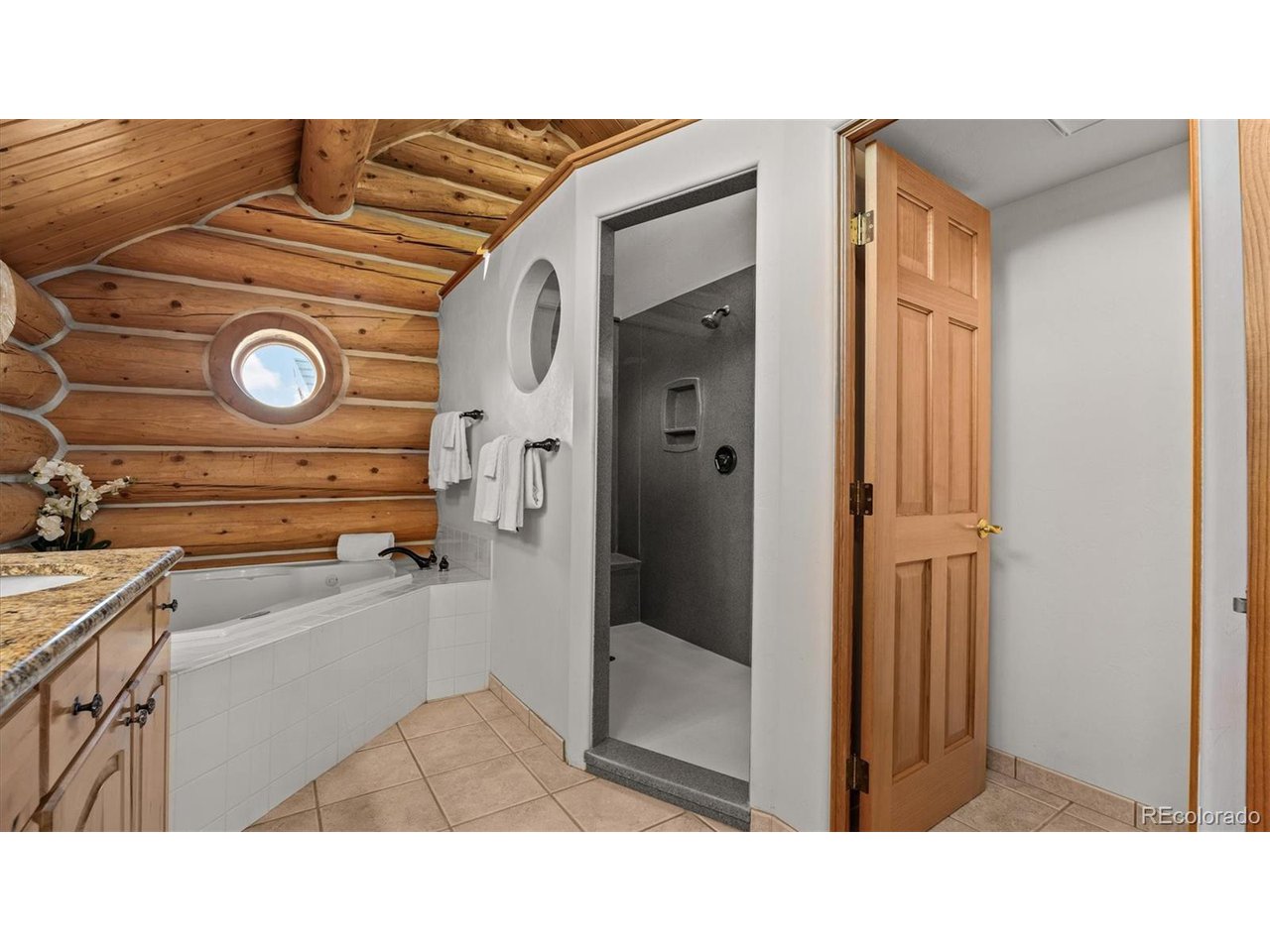 3875 F F 3/4 Road Palisade, CO 81526 - Photo 31 of 45 a bathroom with a sink and a mirror