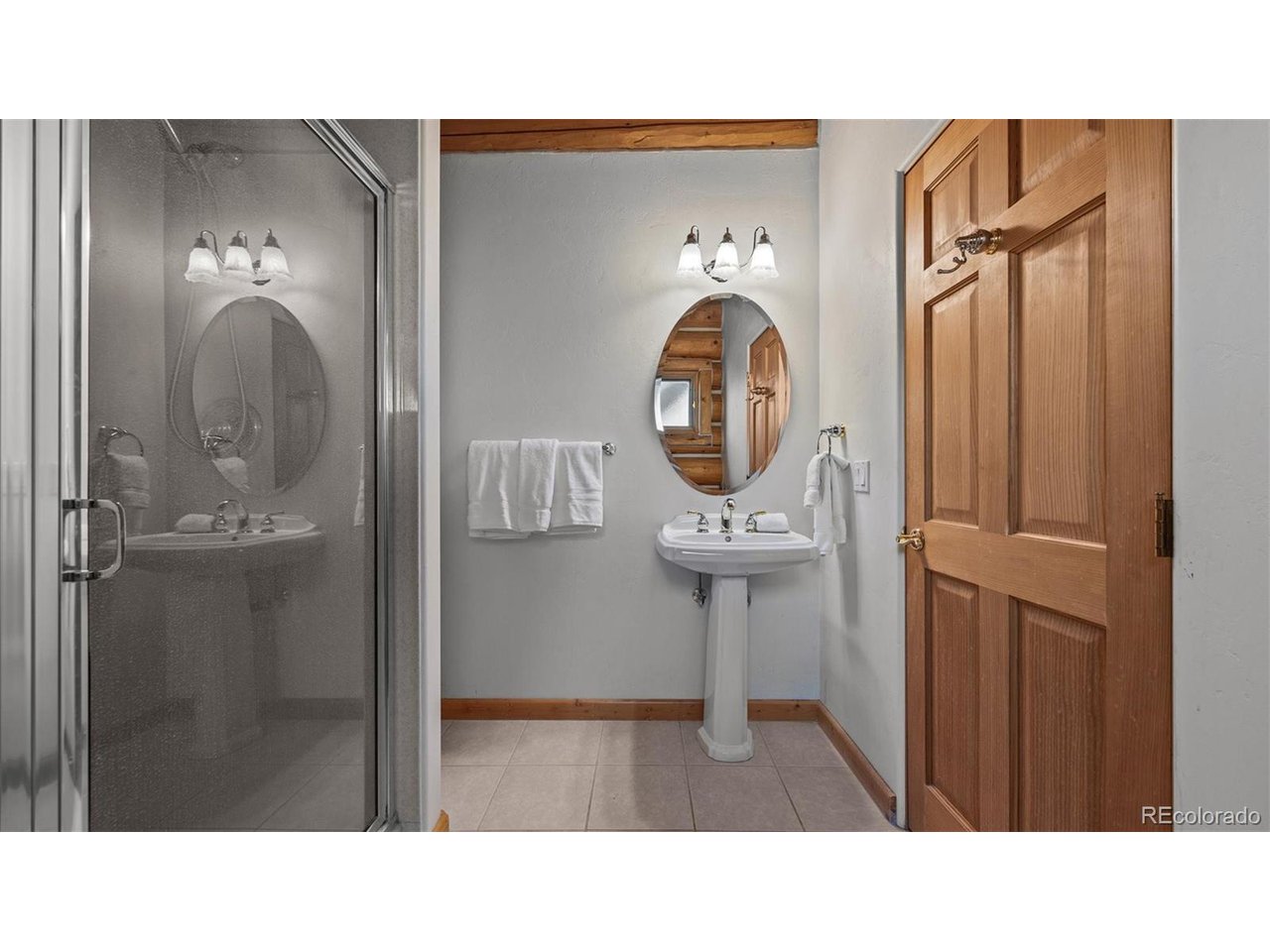 3875 F F 3/4 Road Palisade, CO 81526 - Photo 36 of 45 a bathroom with a sink mirror and toilet