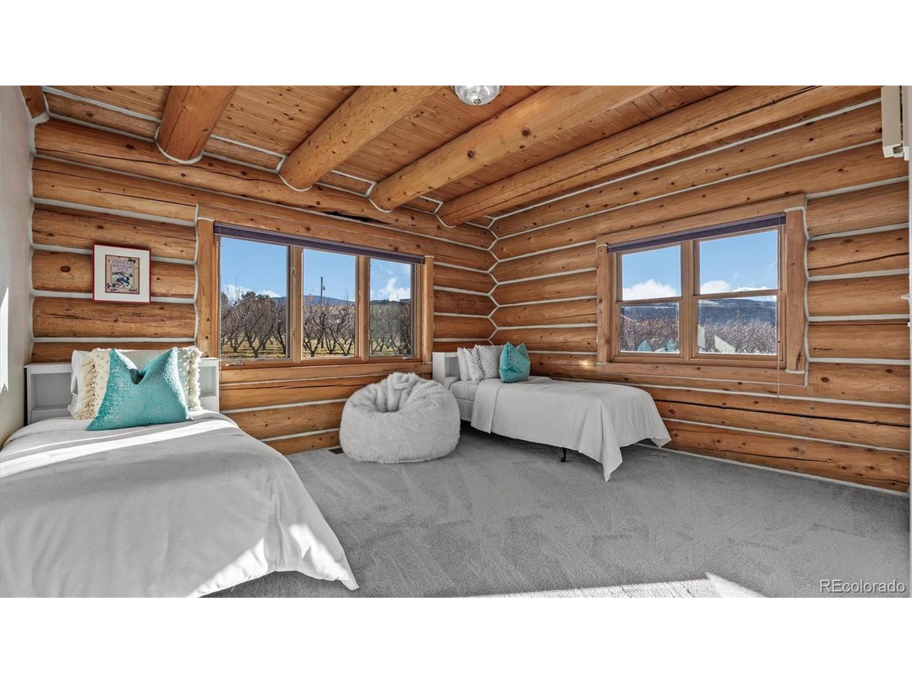 3875 F F 3/4 Road Palisade, CO 81526 - Photo 38 of 45 a bedroom with a bed and a large window