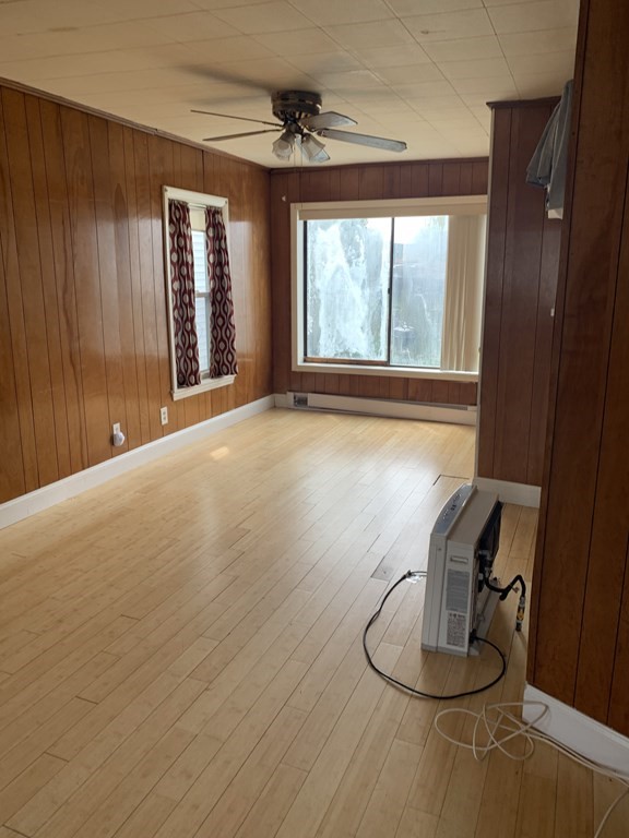 a room with wooden floor and a window