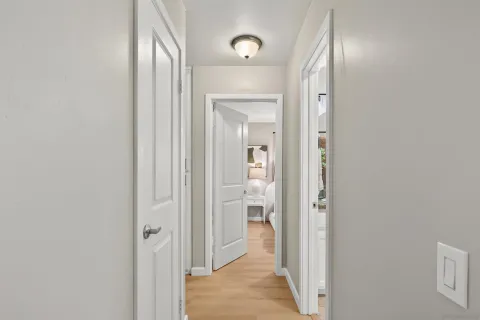 a bathroom with a granite countertop sink toilet and a mirror