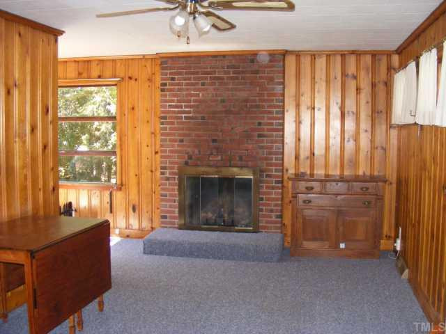 2105 Ruffin Street Durham, NC 27704 - Photo 4 of 7 Den was added on and has gas log fireplace. Seller says hardwoods under carpet. Den/Family/Great Room