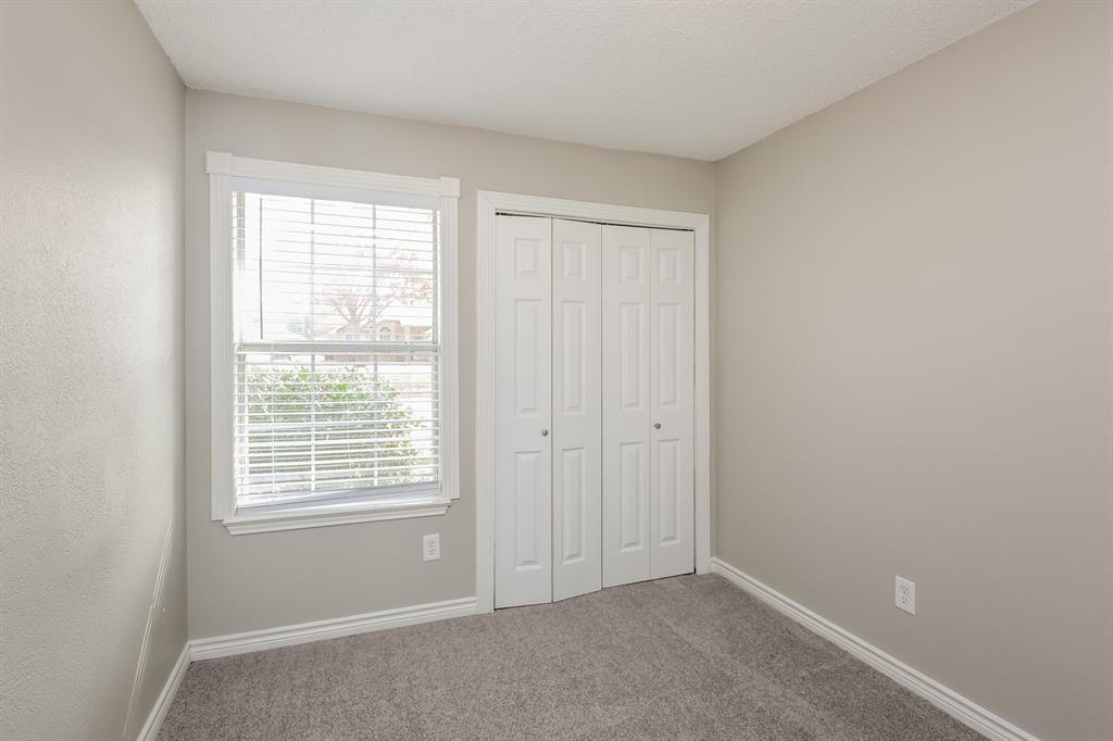8209 Quail Glenn Court Rowlett, TX 75089 - Photo 11 of 16 a view of an empty room with a window