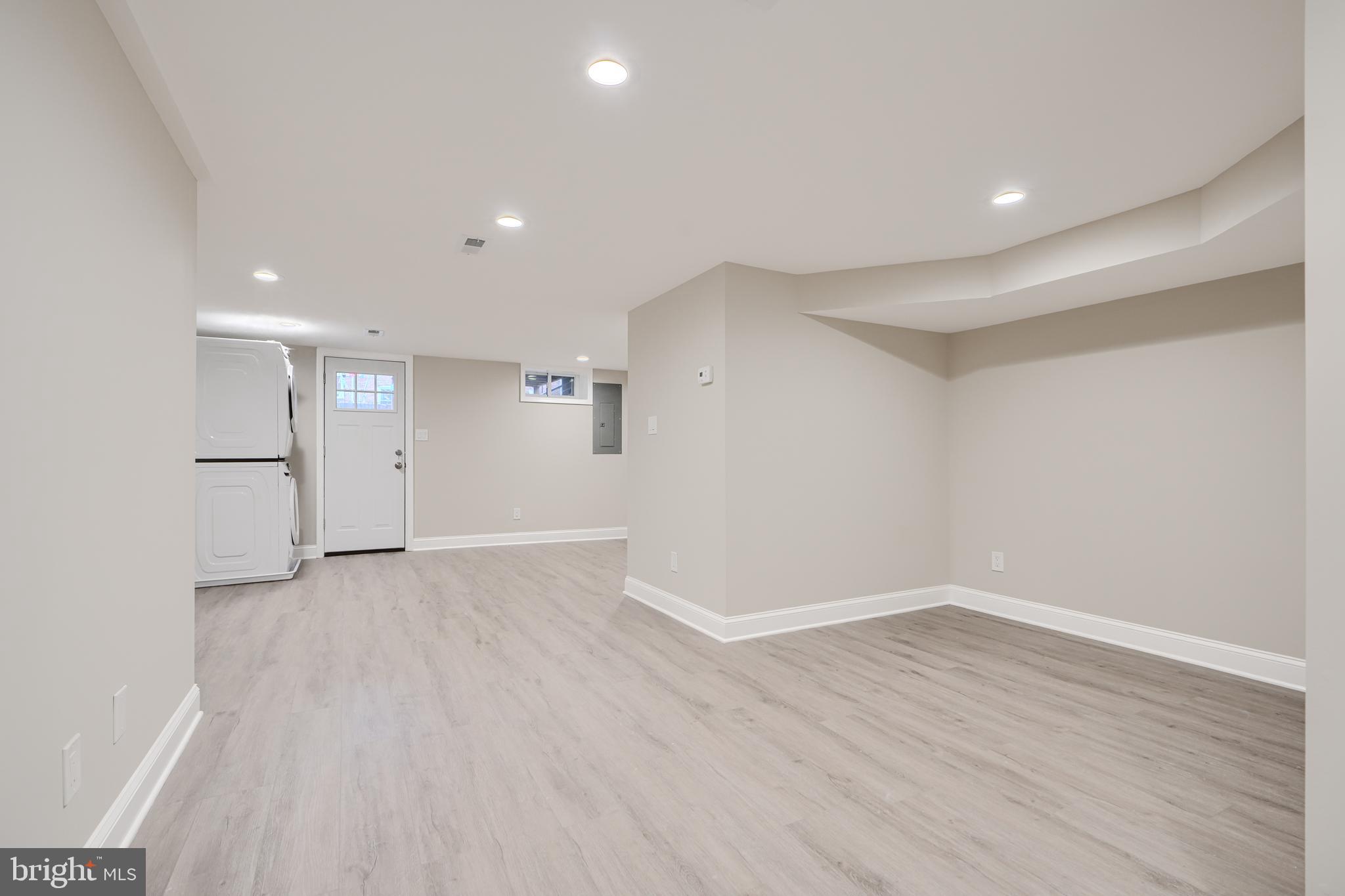 621 Ponca Street Baltimore, MD 21224 - Photo 15 of 38 a view of an empty room with wooden floor