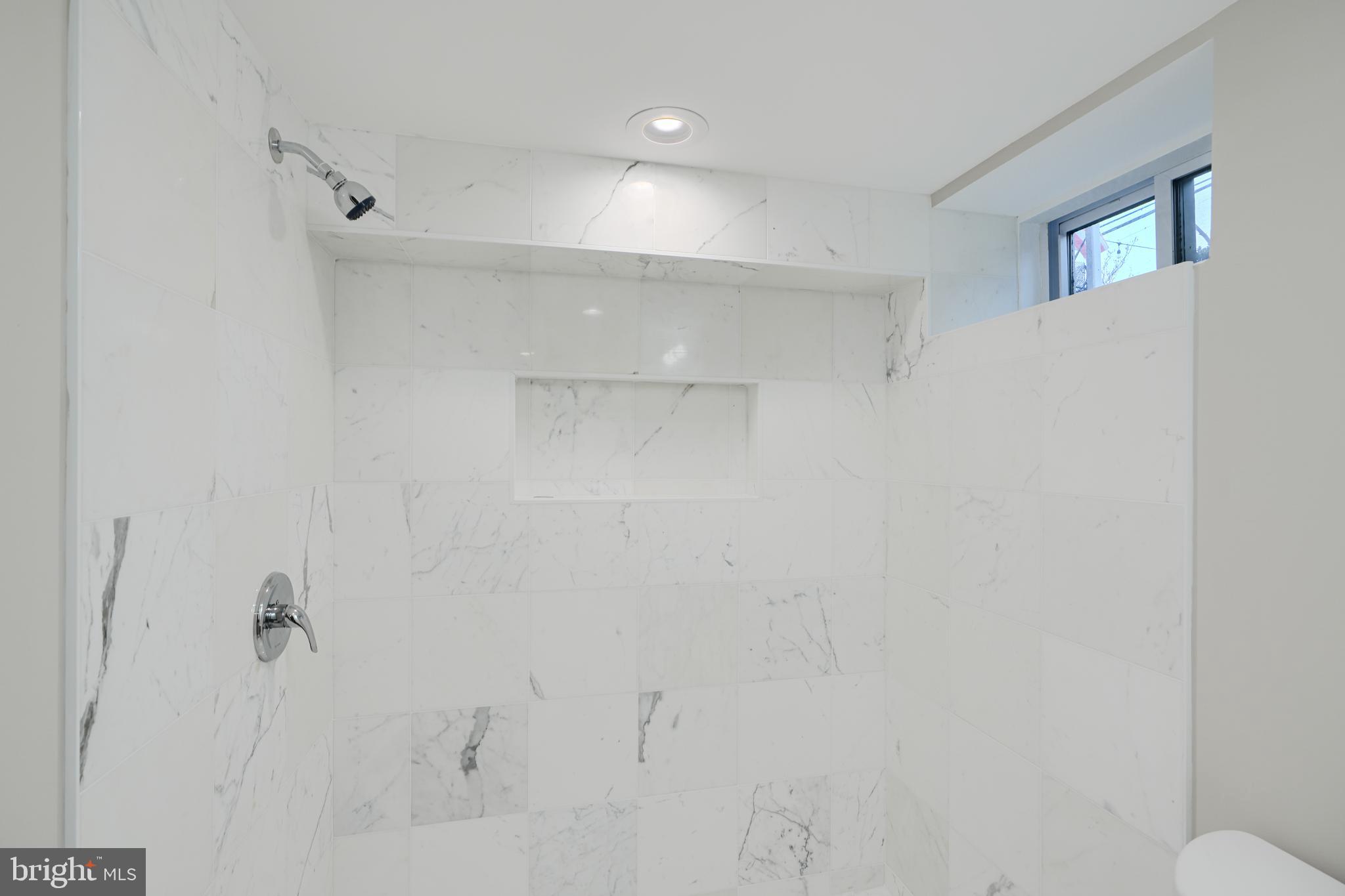 621 Ponca Street Baltimore, MD 21224 - Photo 20 of 38 a bathroom with a shower