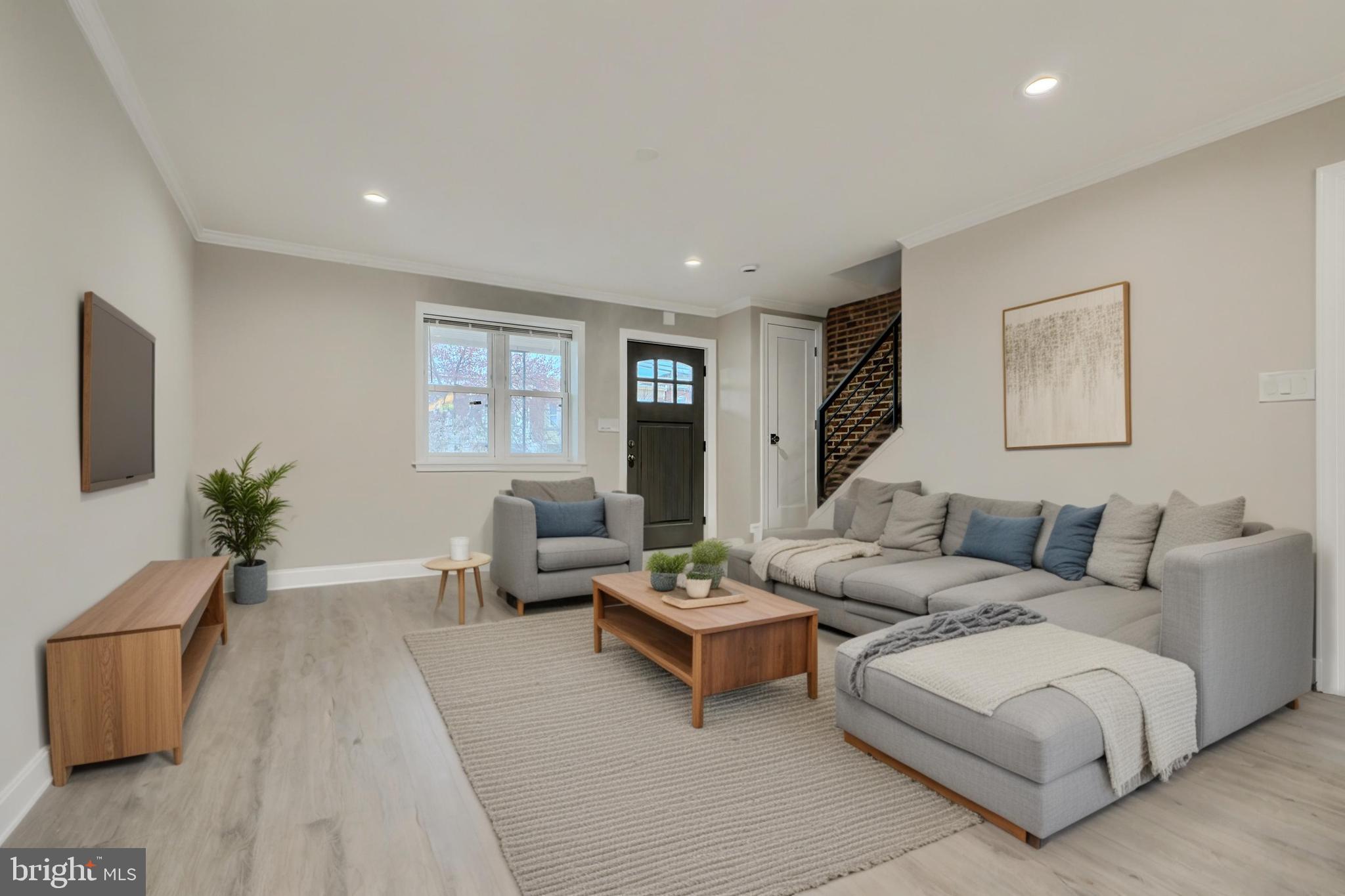 621 Ponca Street Baltimore, MD 21224 - Photo 2 of 38 a living room with furniture and wooden floor