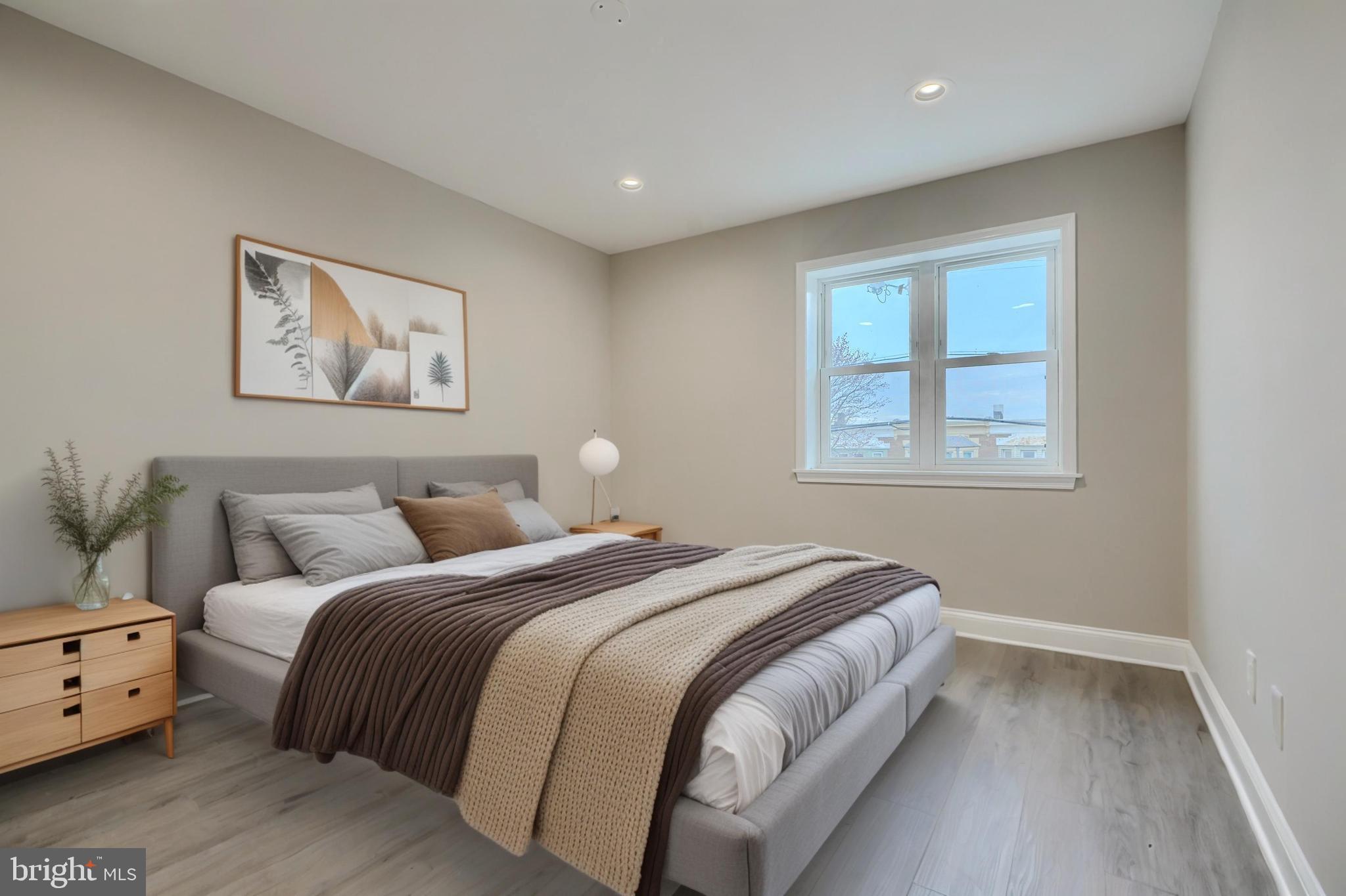 621 Ponca Street Baltimore, MD 21224 - Photo 21 of 38 a bedroom with a bed and a window