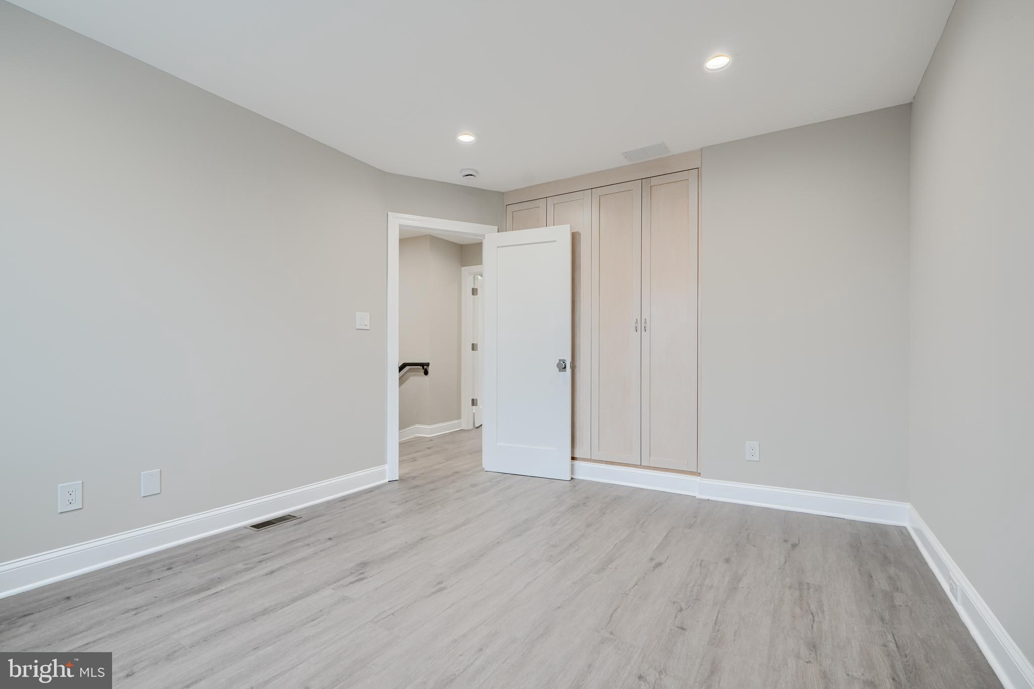 621 Ponca Street Baltimore, MD 21224 - Photo 24 of 38 a view of an empty room with wooden floor