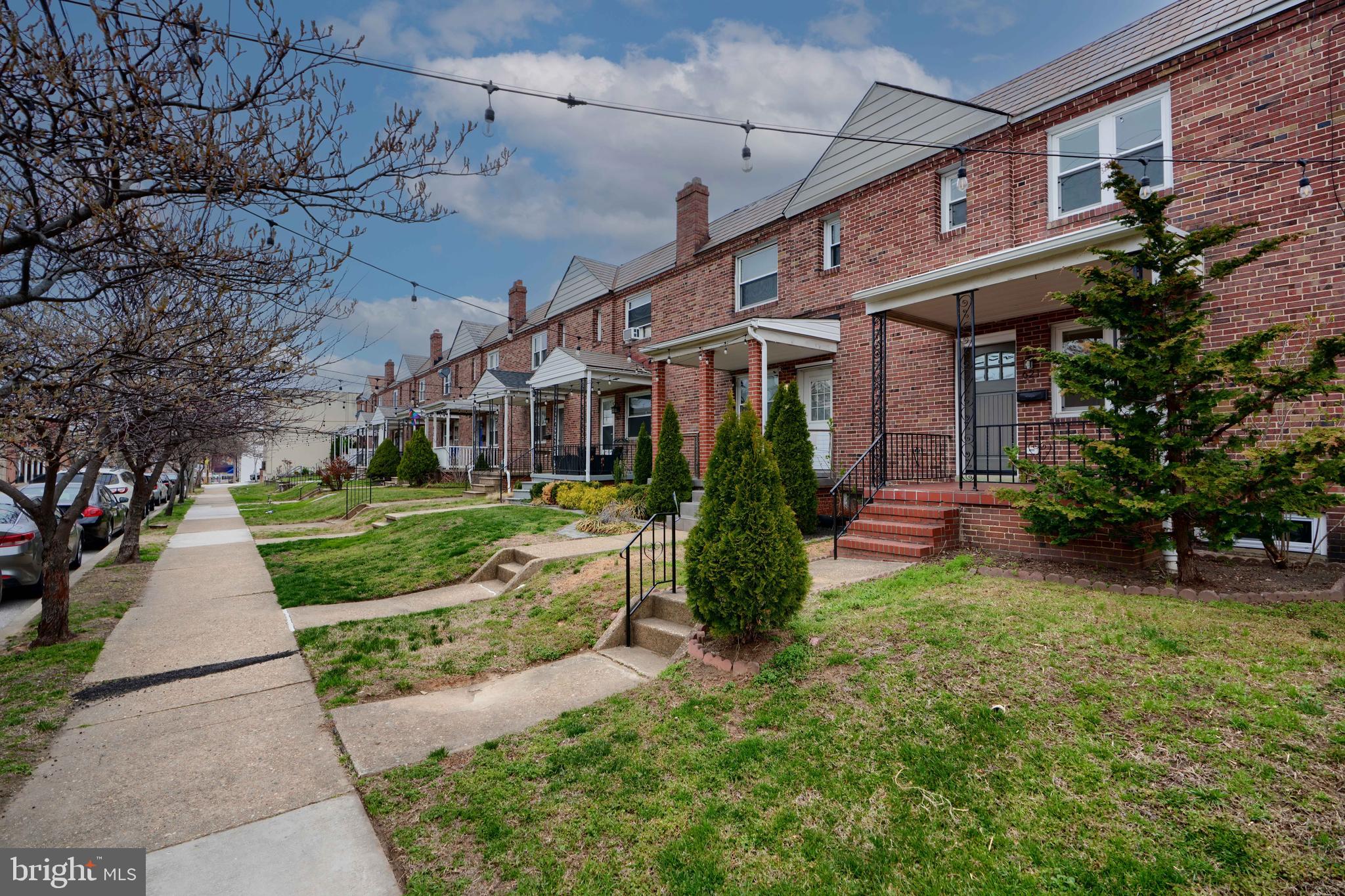 621 Ponca Street Baltimore, MD 21224 - Photo 32 of 38 a view of a house with a small yard and plants