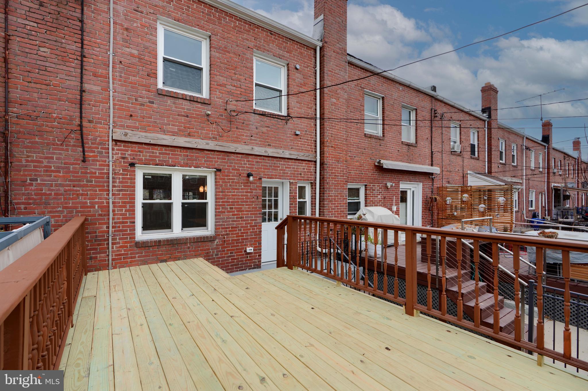 621 Ponca Street Baltimore, MD 21224 - Photo 36 of 38 a front view of a house with many windows