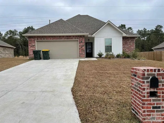 a front view of a house with yard