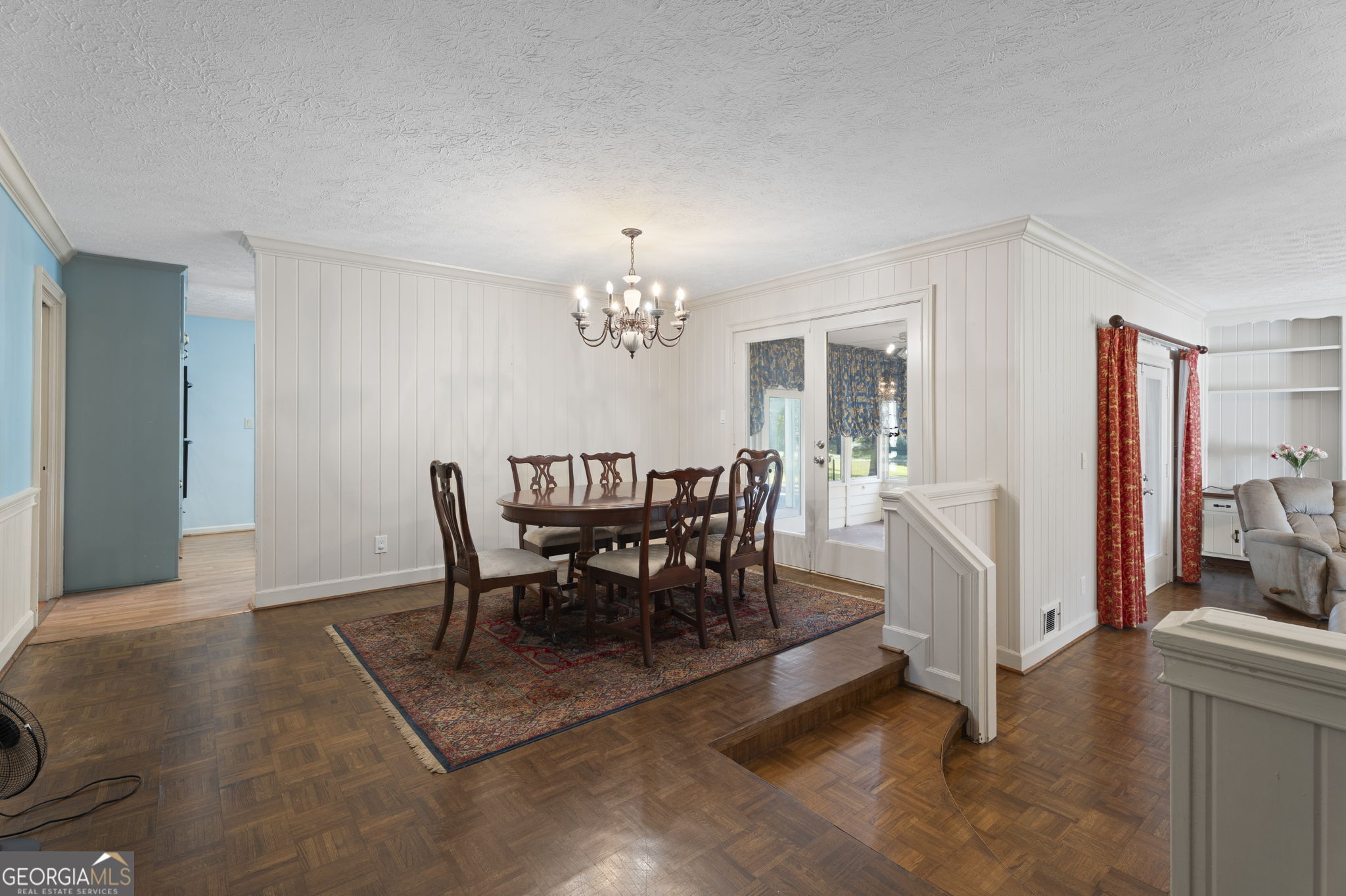 1080 Conyers Road McDonough, GA 30252 - Photo 12 of 55 a view of a dining room with furniture and chandelier