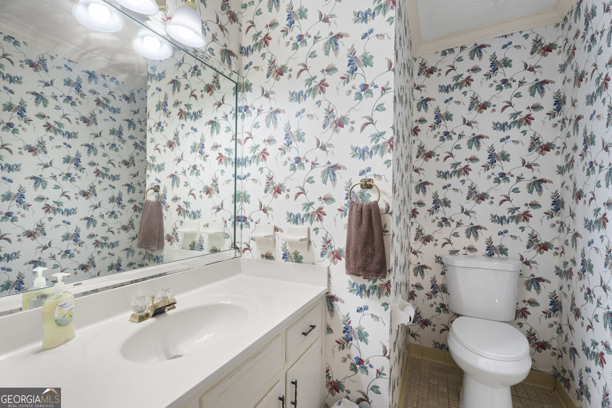 1080 Conyers Road McDonough, GA 30252 - Photo 20 of 55 a bathroom with a sink toilet and shower