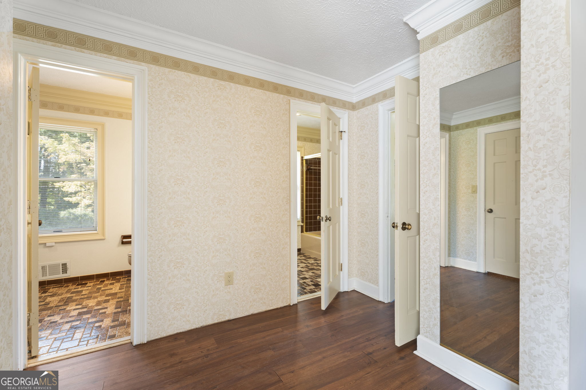 1080 Conyers Road McDonough, GA 30252 - Photo 26 of 55 a view of an empty room with wooden floor and a window