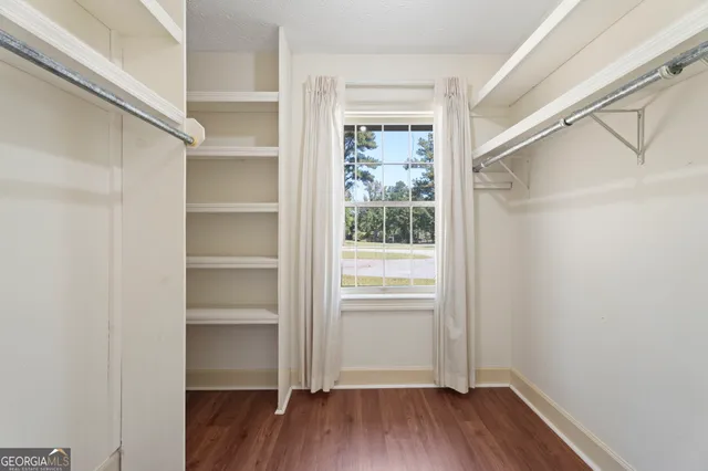 an empty room with closet area