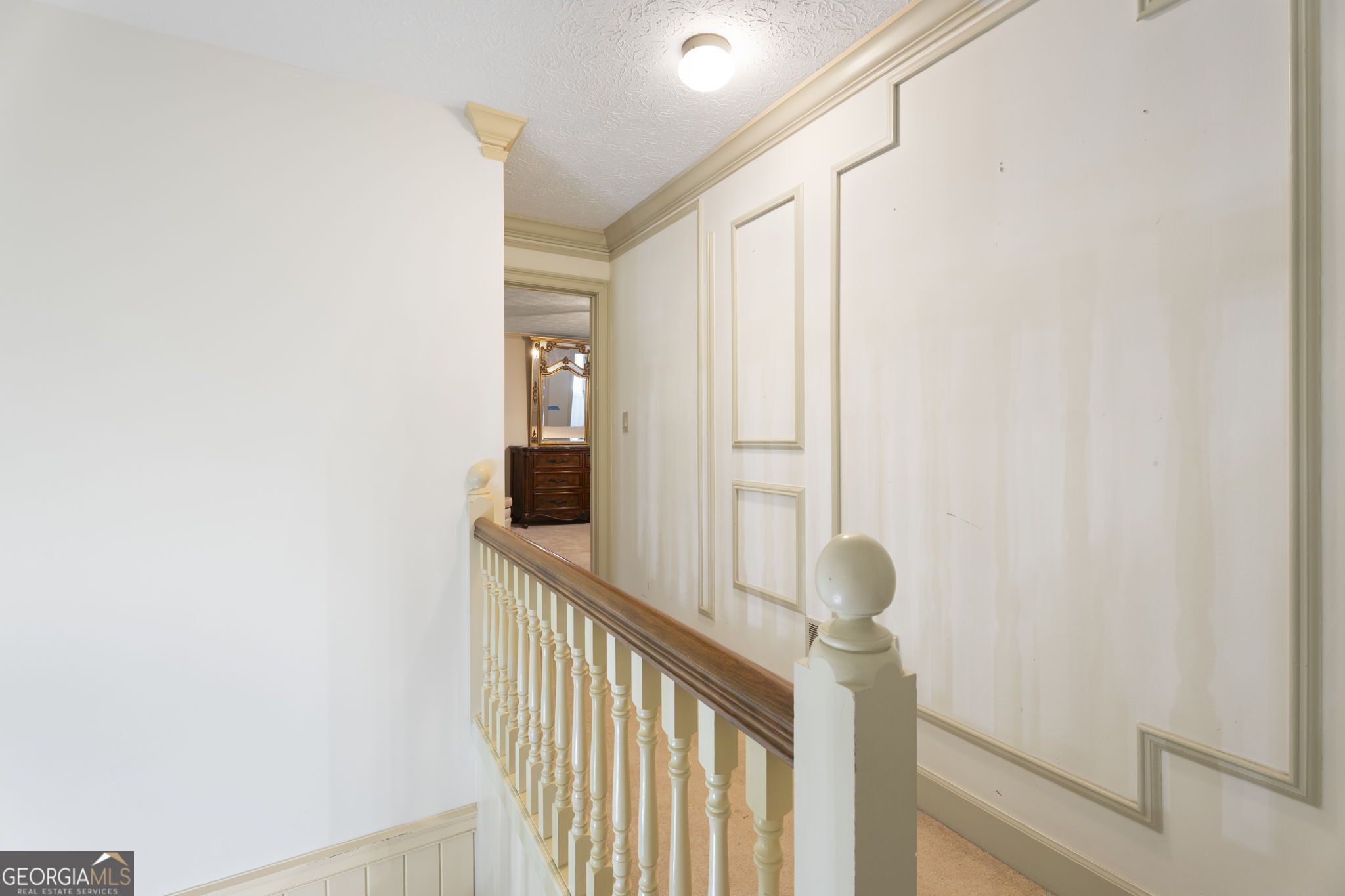 1080 Conyers Road McDonough, GA 30252 - Photo 29 of 55 a view of a hallway with wooden floor and staircase