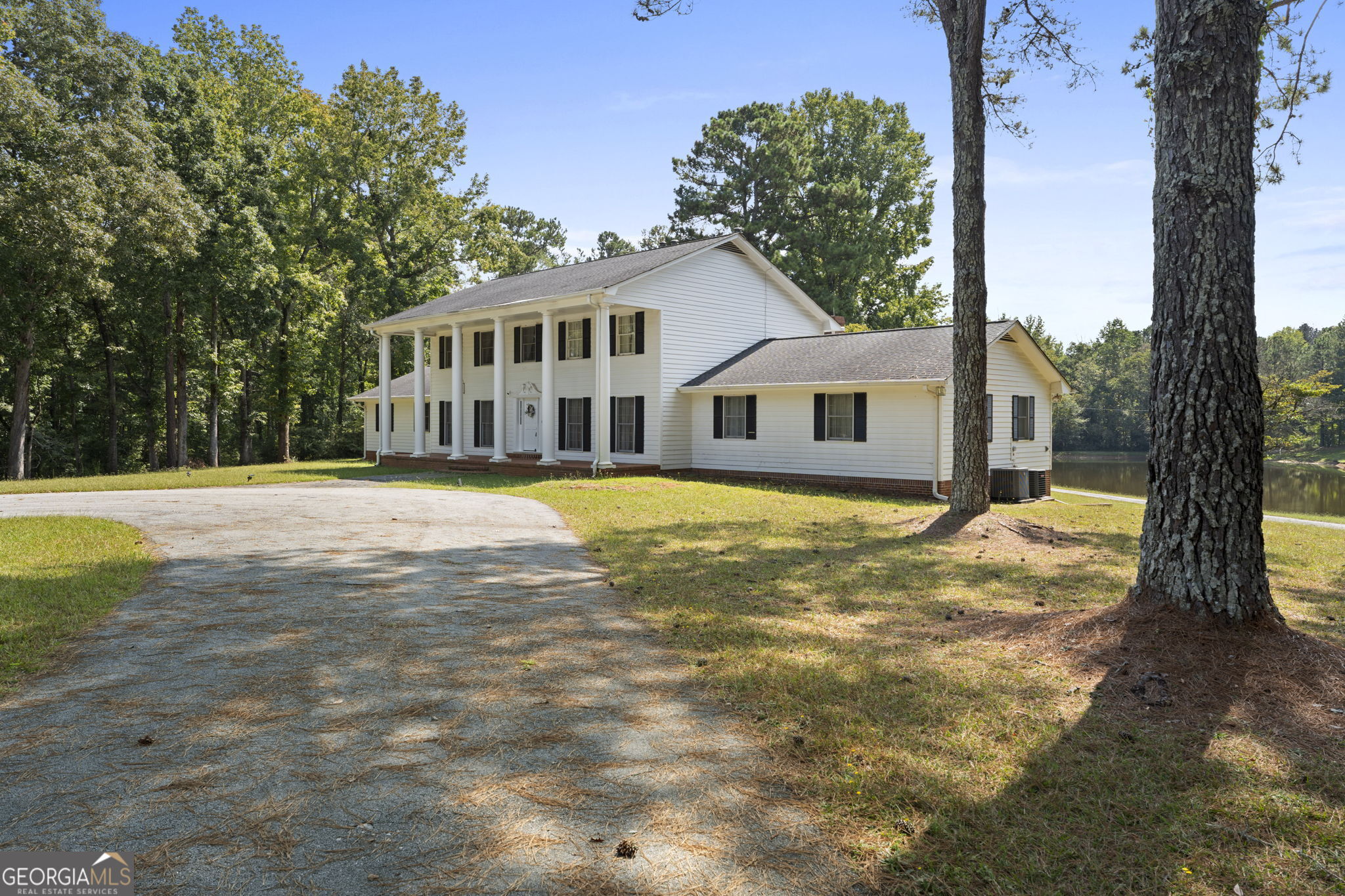 1080 Conyers Road McDonough, GA 30252 - Photo 3 of 55 a view of a house with a yard